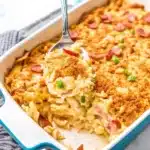 Neiman Marcus Chicken Casserole topped with golden Ritz cracker crumbs and garnished with green onions